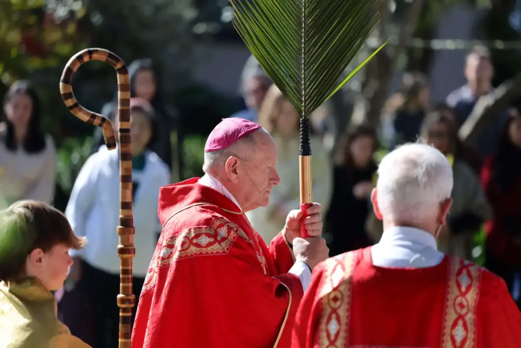 Bishop Robert F. Vasa leads a Palm Sunday service at...