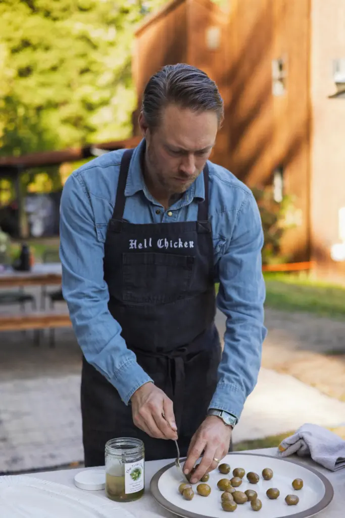 Chef Lee Desrosiers prepares a simple appetizer with olives and...