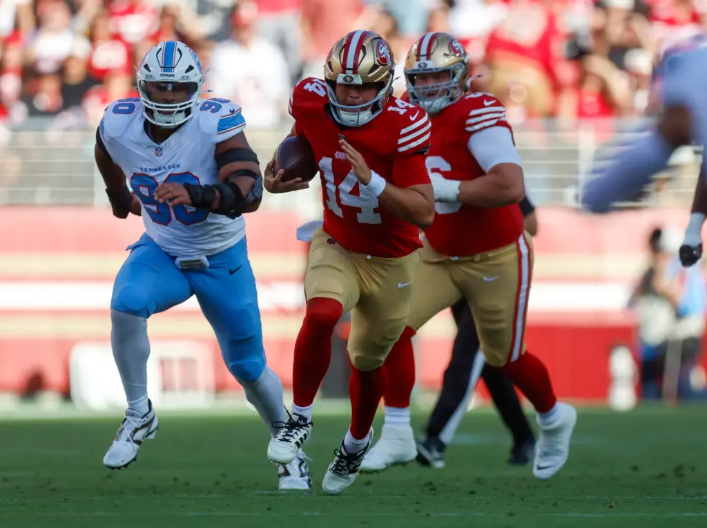 San Francisco 49ers' Kurtis Rourke (14) scrambles against the Tennessee...