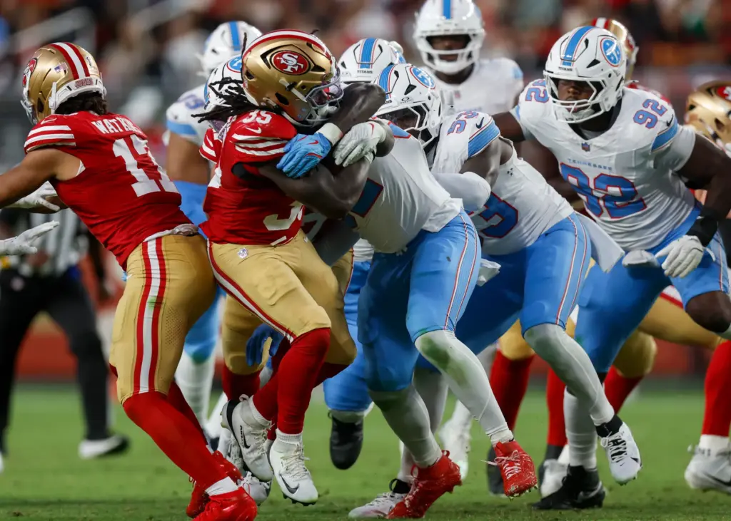 San Francisco 49ers' Sincere McCormick (35) is tackled by the...