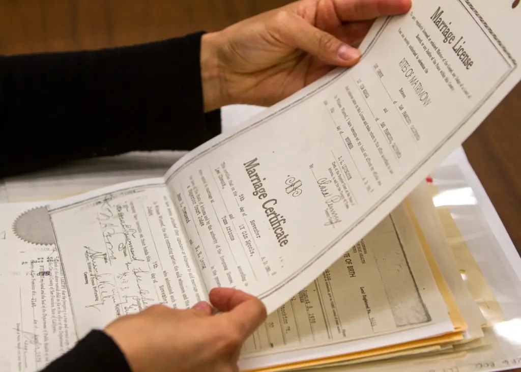Lenora Lee looks through records of her relatives at the...