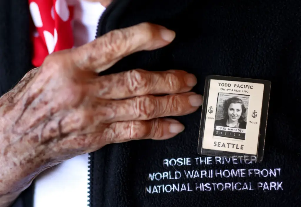 Former Rosie the Riveter Jeanne Gibson, 98, displays her badge...