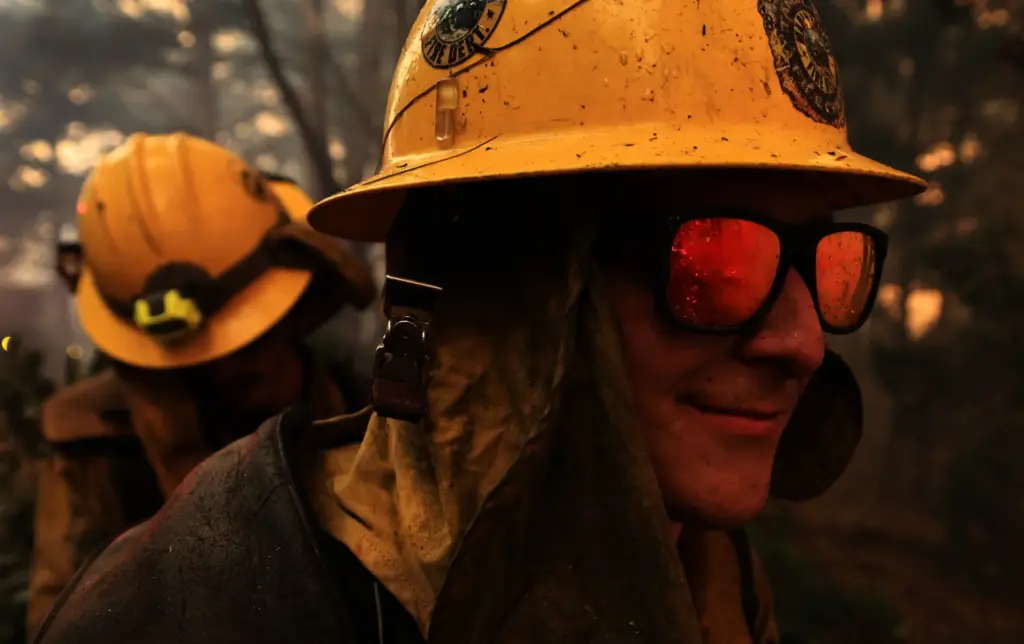 Fire is reflected in the sunglasses of a Mount Tamalpais...