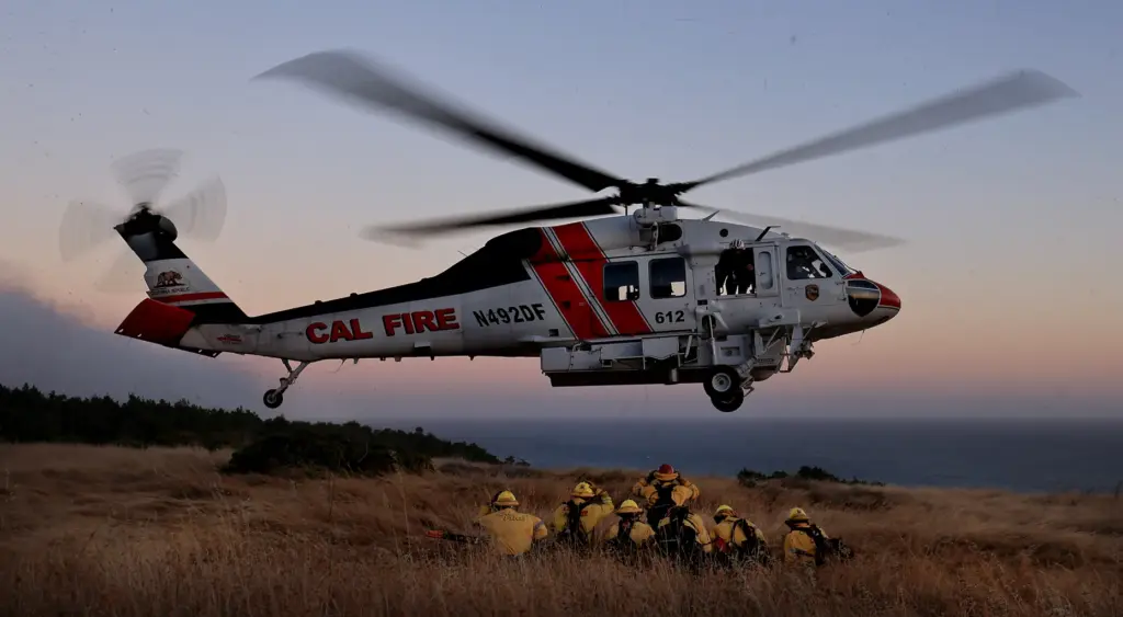 Cal Fireâs Boggs Mountain Helitack crew is picked up at...