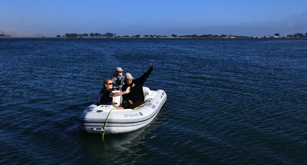 Ultra endurance swimmer Catherine Breed right with crew members Heather...