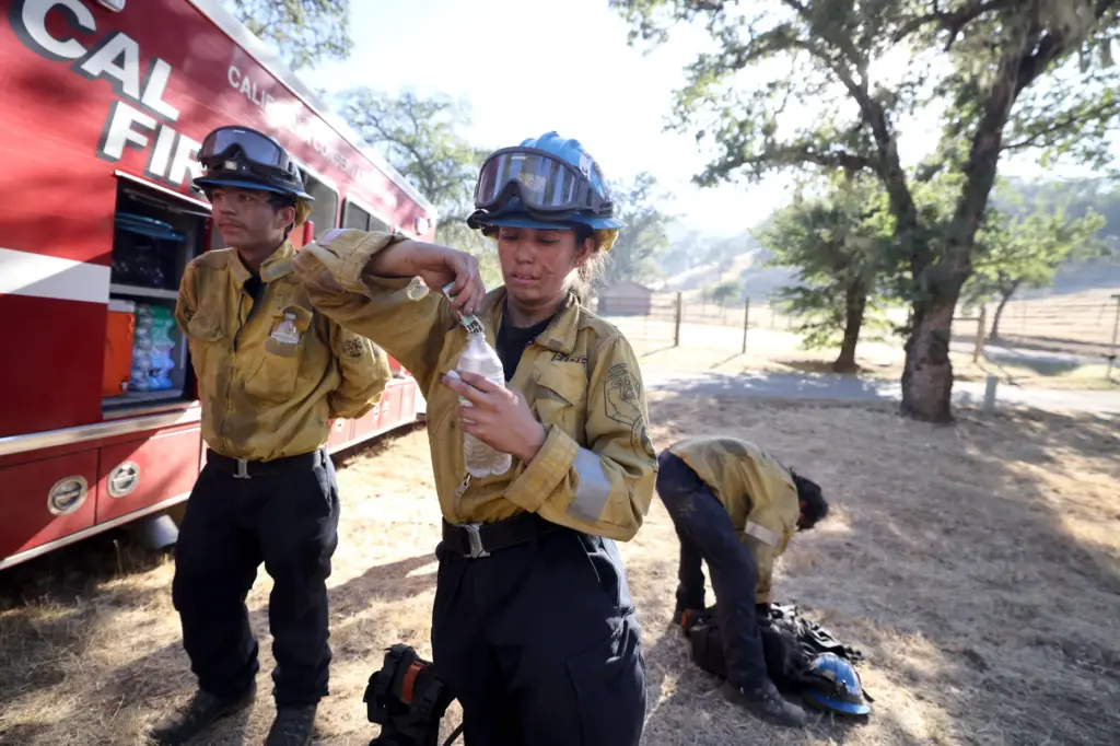 Firefighters from the California Conservation Corps overseen by Cal FireÂ rest...