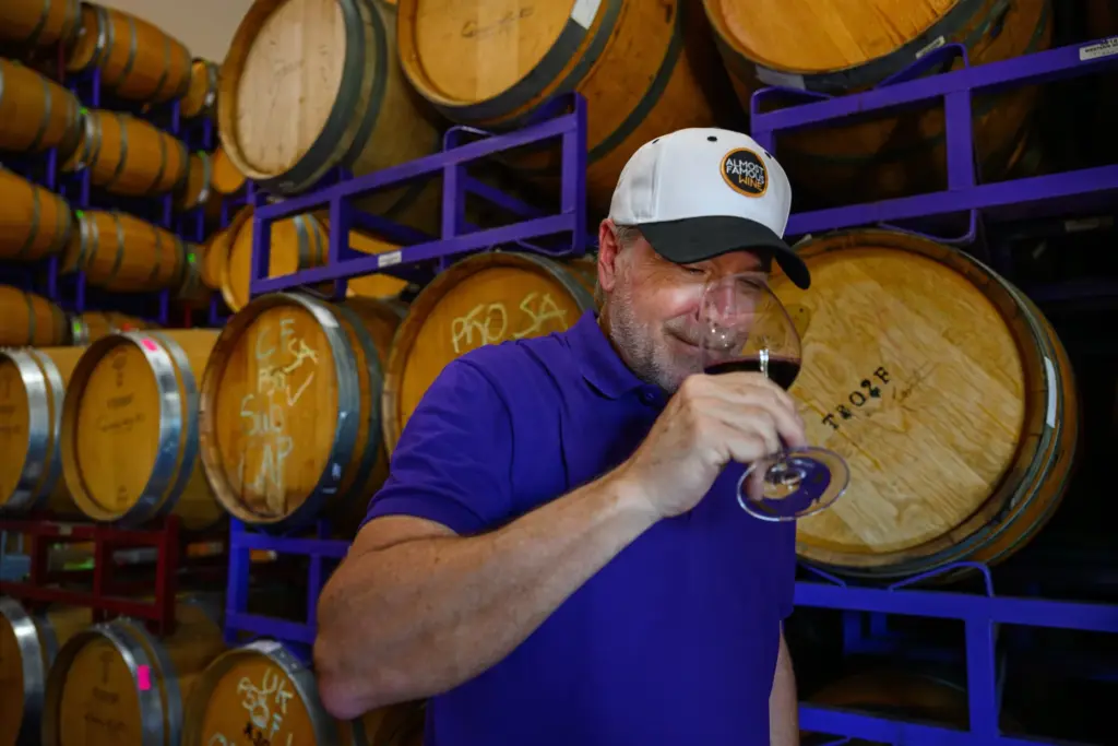 Darcie Kent Estate Winery co-owner David Kent prepares to taste...