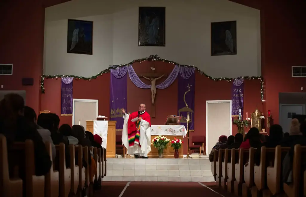 Our Lady of Guadalupe parishioners attend mass at the Windsor...