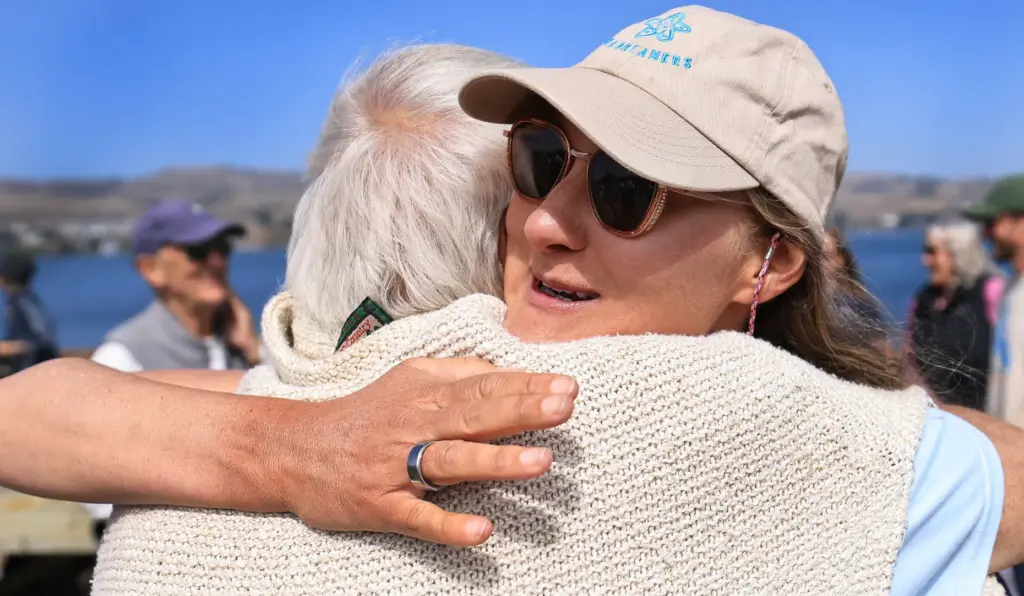 Catherine Breed greets her grandfather Leonardo Vacchina during a stop...
