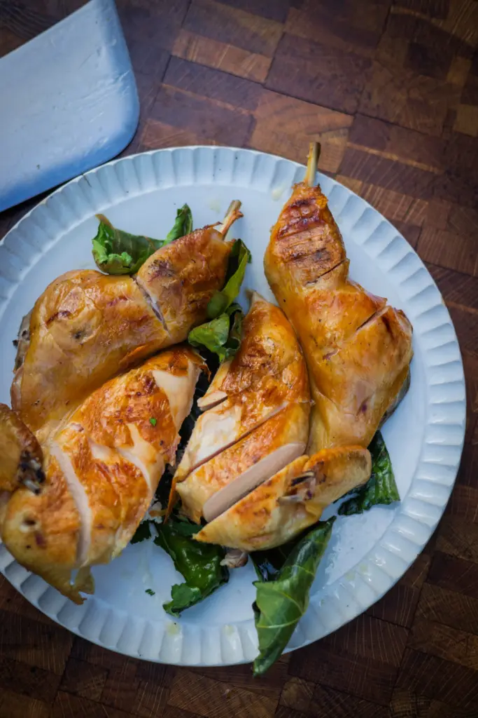 Chef Lee Desrosiers’ signature “Hell Chicken” he slow-roasts over coals....