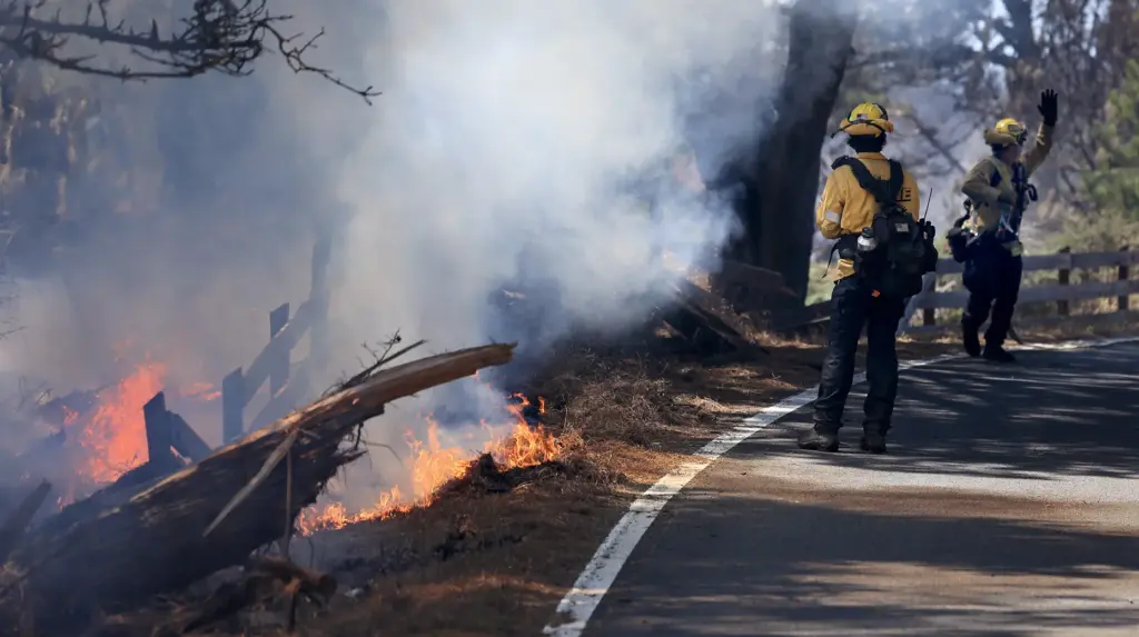 A spot fire along Highway 1, erupts as Cal Fire...