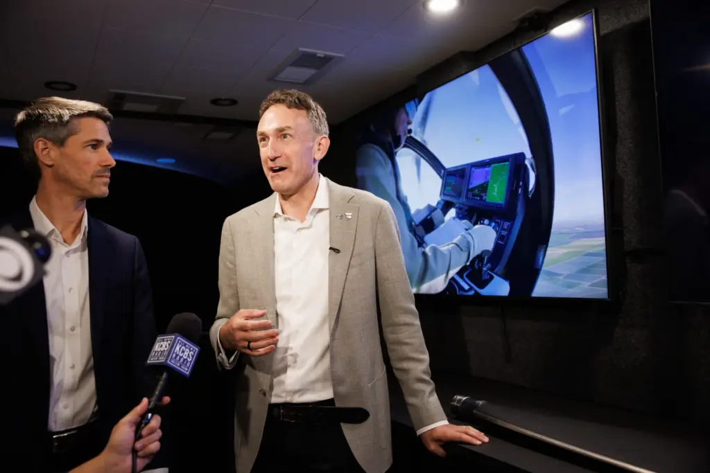 Joby Aviation Chief Product Officer Eric Allison, right, speaks during...