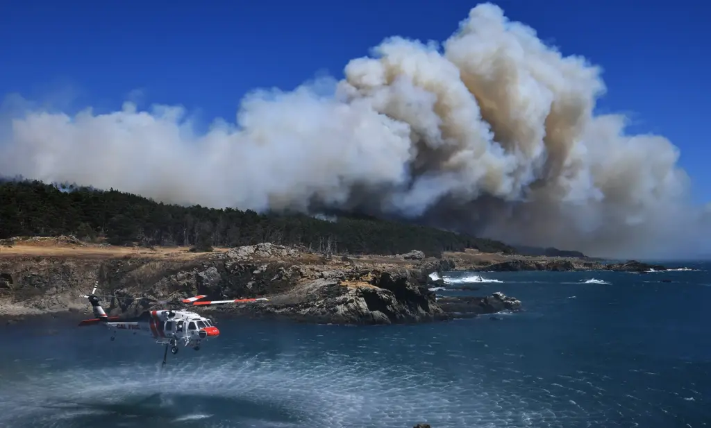The Woodside Fire burns at Salt Point State Park, Thursday,...