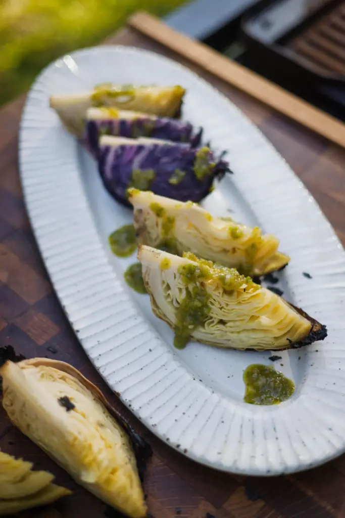Slow-roasted cabbage topped with a spicy, tangy sauce made with...