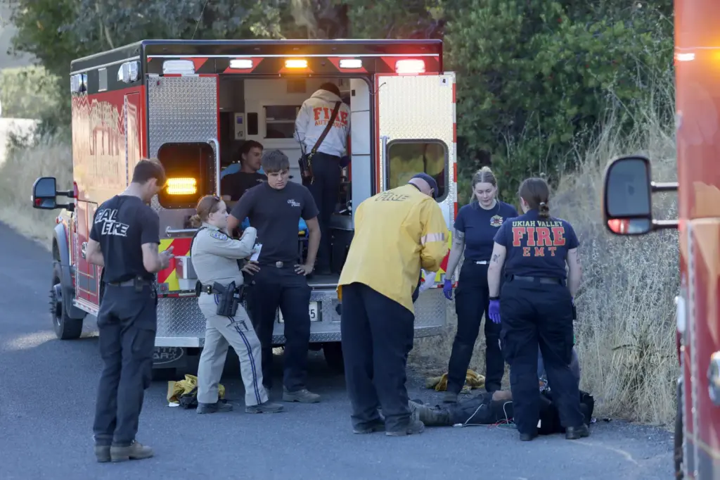 Before being transported to a hospital, Cal FireÂ firefighters are assessed...