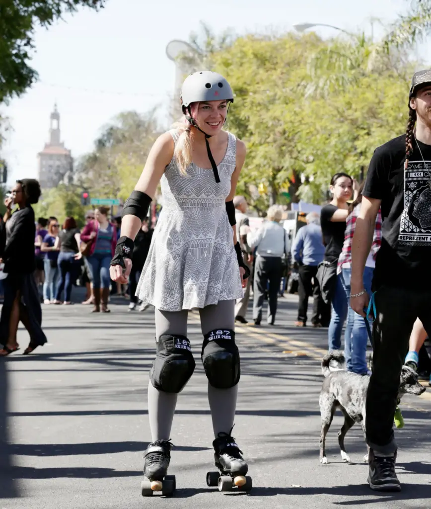 A girl skates down First Street at the SoFA Street...