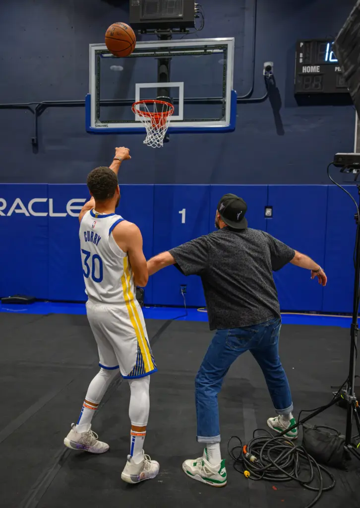 Golden State Warriorsâ Stephen Curry (30) plays with team photographer...