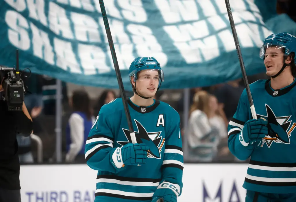 San Jose Sharks' Macklin Celebrini (71) chats with San Jose...