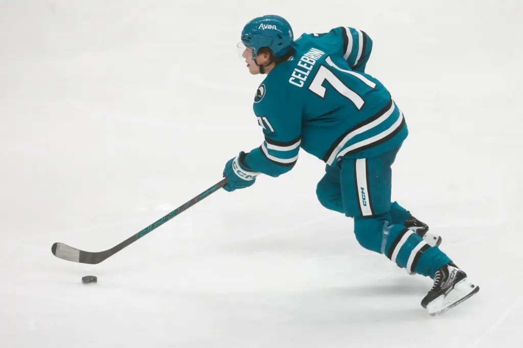 San Jose Sharks' Macklin Celebrini (71) controls the puck against...