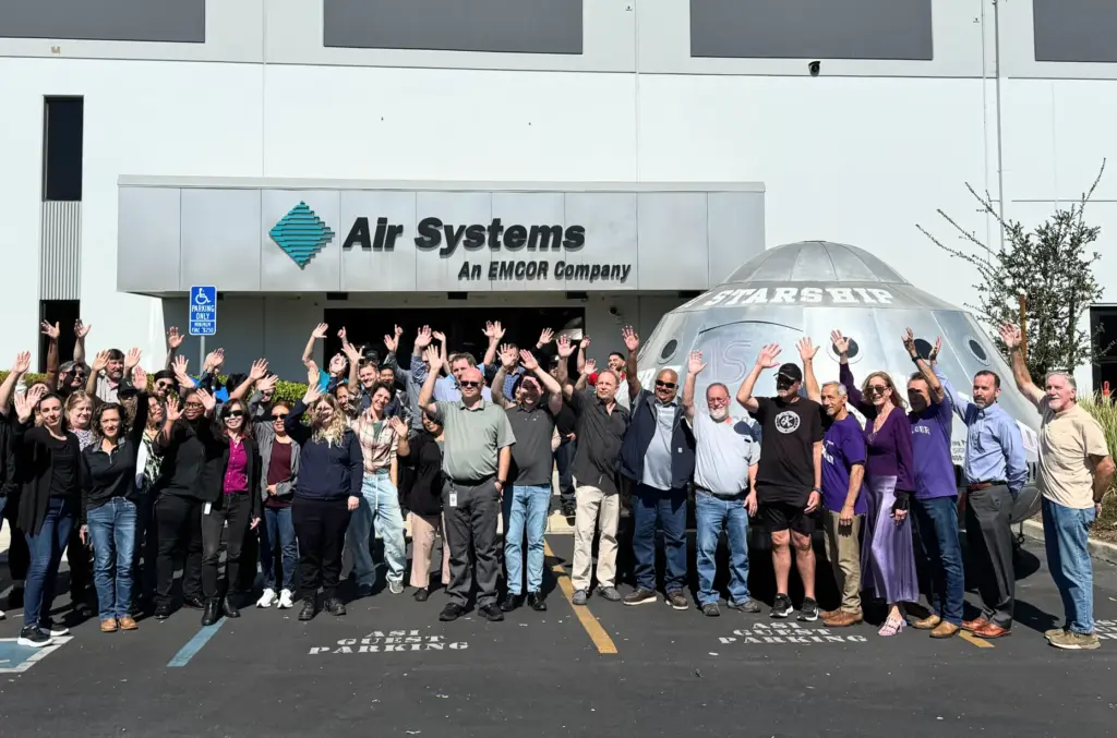 Employees from Air Systems Inc. pose with the Messenger II,...