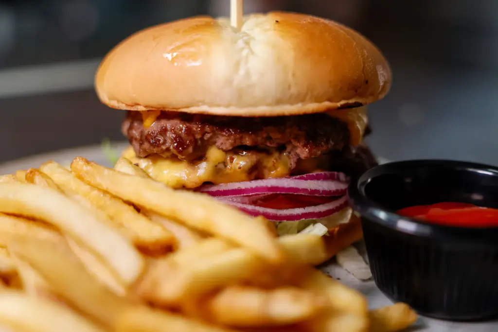 A smash burger featuring two Wagyu beef patties with cheddar,...