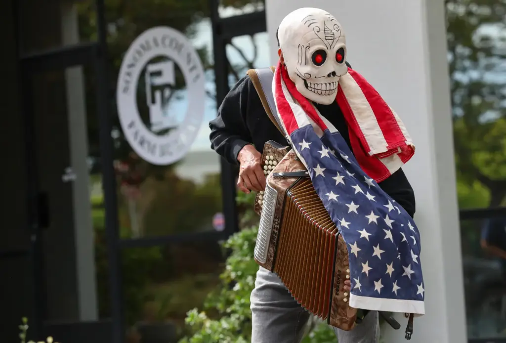 Nicolas Valdez performs during a Sonoma County Sanctuary Coalition protest...