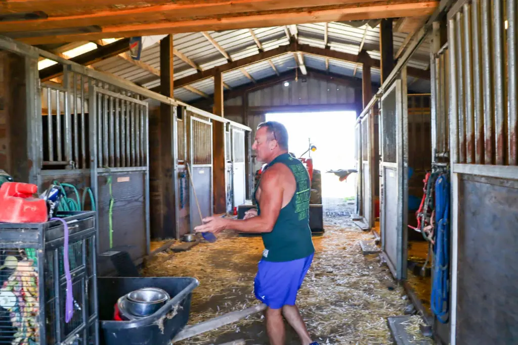 Shannon Miranda walks through the barn where dogs were quarantined...