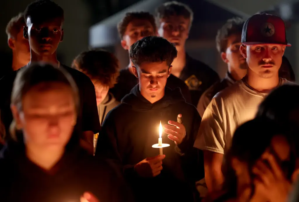 Students attend a vigil for seniors Dominic Ferrari, and Caden...