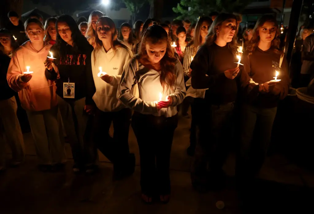 Hundreds attend a vigil for seniors Dominic Ferrari, and Caden...