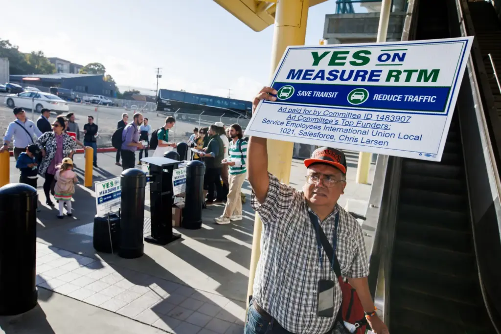 Measure RTM supporter Henry Schroeder of San Mateo holds a...
