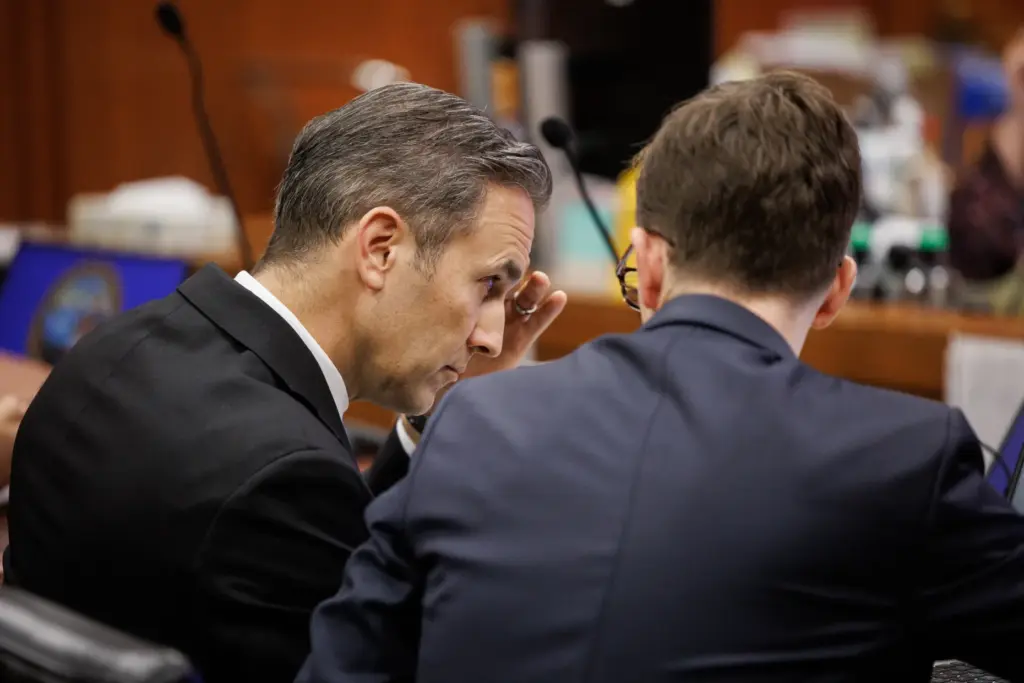 Deputy District Attorney O'Bryan Kenney, left, appears during a hearing...