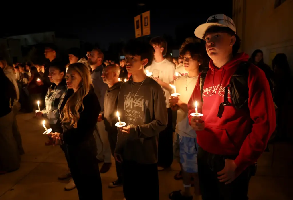 Hundreds attend a vigil for seniors Dominic Ferrari, and Caden...