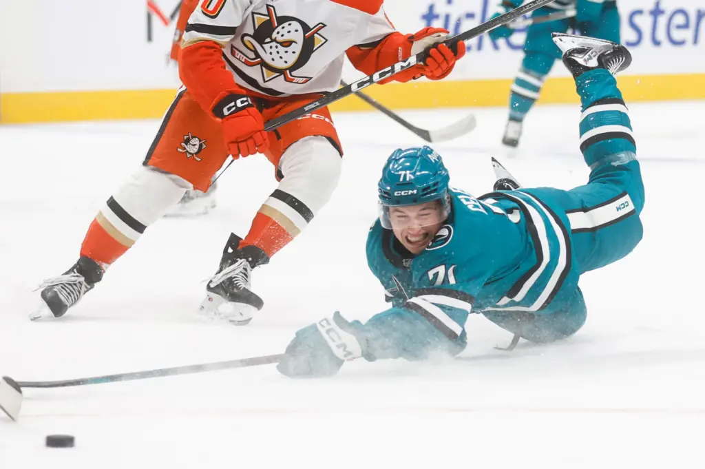 San Jose Sharks' Macklin Celebrini (71) tries to get a...