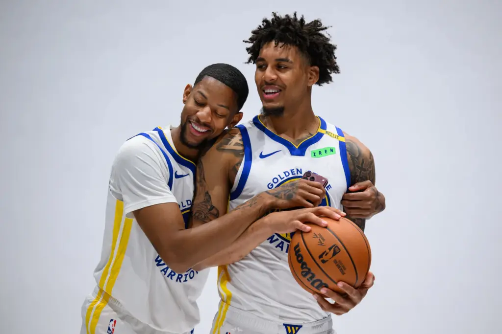 Golden State Warriorsâ Dalen Terry (21) hugs Golden State Warriorsâ...
