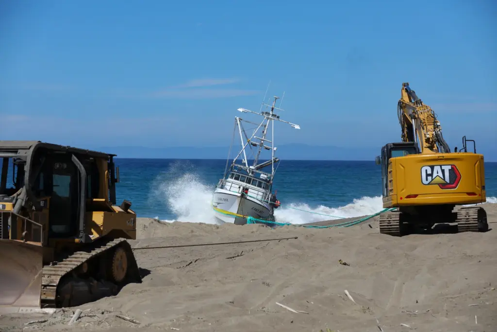 The Lake Bay sits tethered to an excavator on Point...