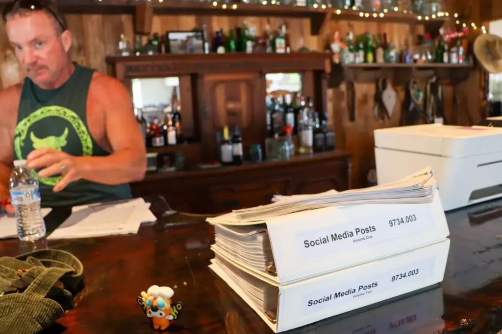 Large binders sit on top of Shannon Miranda’s bar. The...