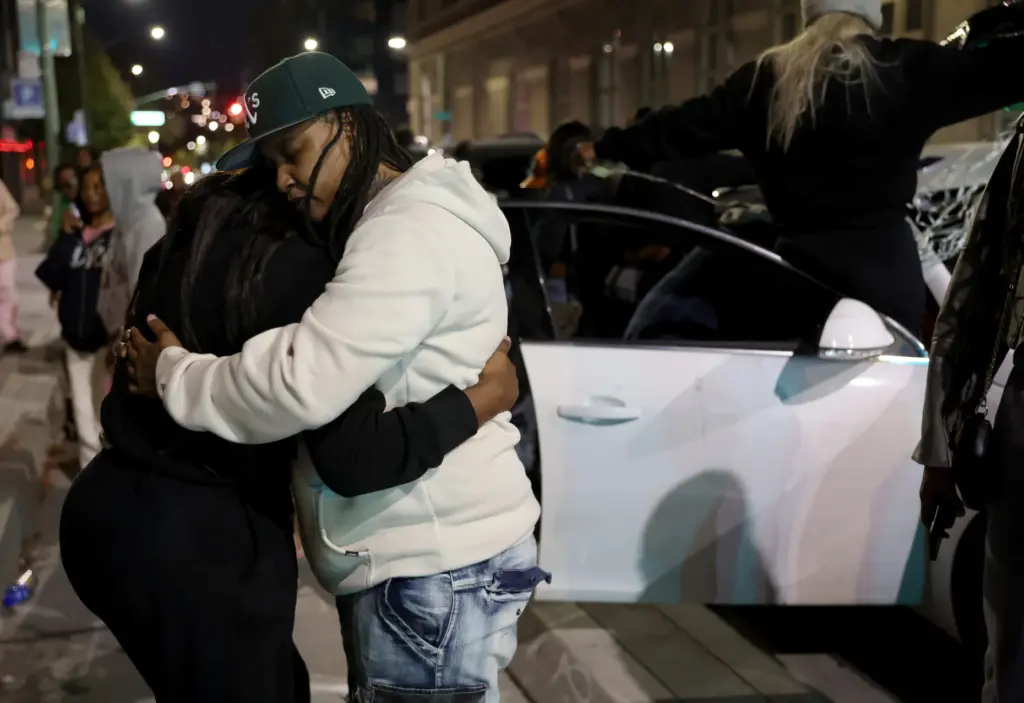 Ebony Thomas, left, aunt of Mackayla âKashâ Paige, gets a...