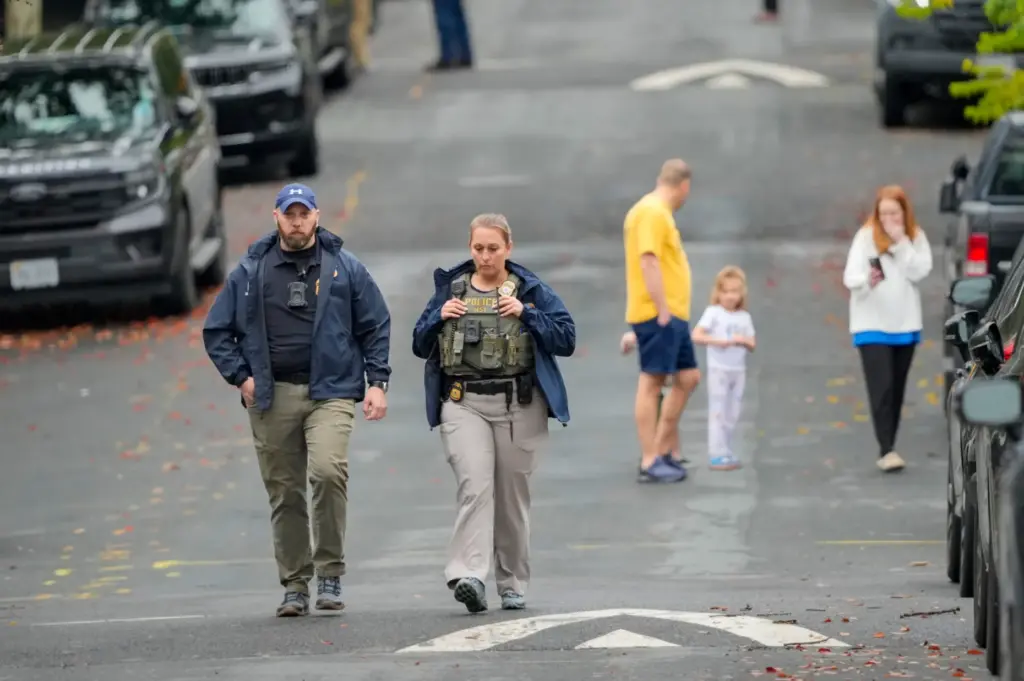 Homeland Security officers walk down 26th Street NE.