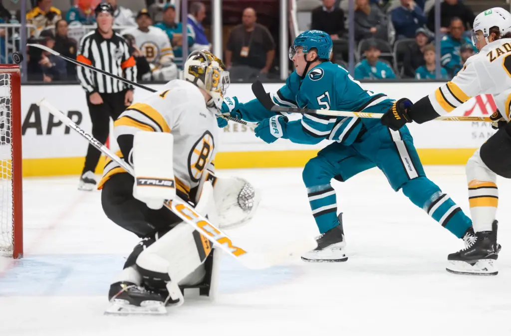 San Jose Sharks' Collin Graf (51) reaches for the puck...