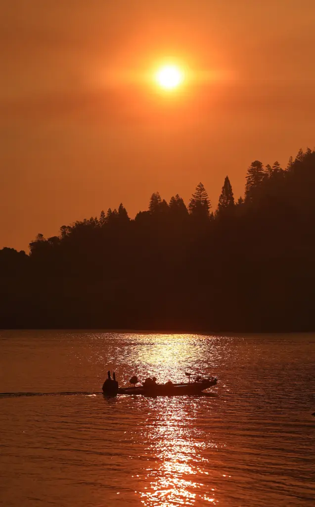 A fisherman takes to Lake Sonoma with a heavy layer...