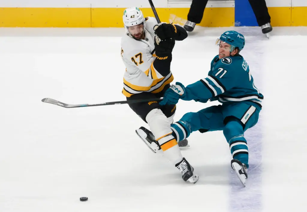 San Jose Sharks' Macklin Celebrini (71) fights for the puck...