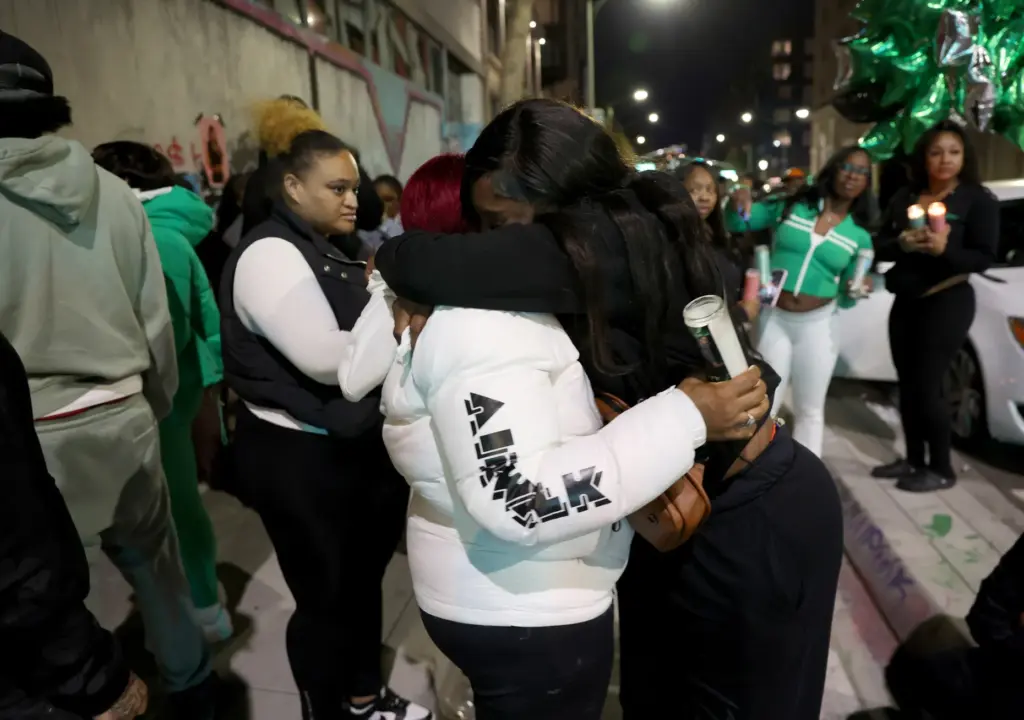 Cynthia Shavers, left, mother of Mackayla âKashâ Paige, gets a...