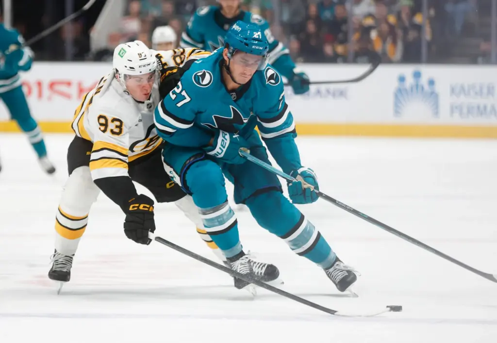 San Jose Sharks' Mason Marchment (27) fights for the puck...