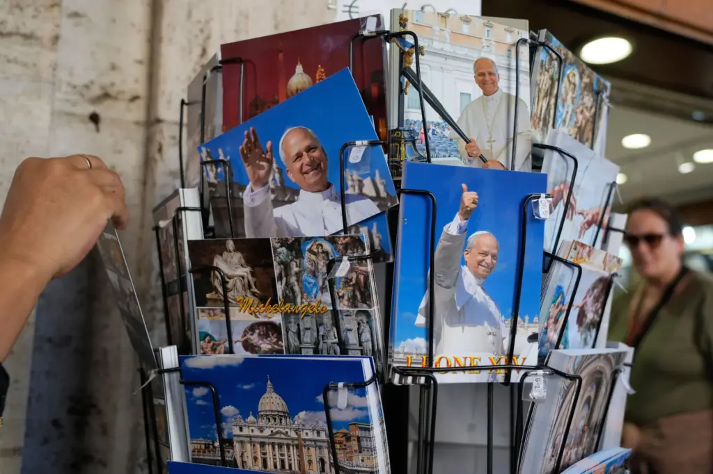 Postcards of Pope Leo XIV are displayed outside a shop near St. Peter's Square.