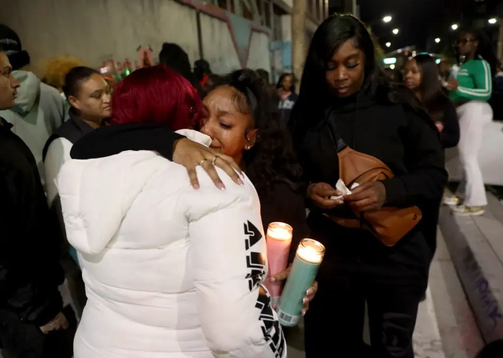 Cynthia Shavers, left, mother of Mackayla âKashâ Paige, gets a...